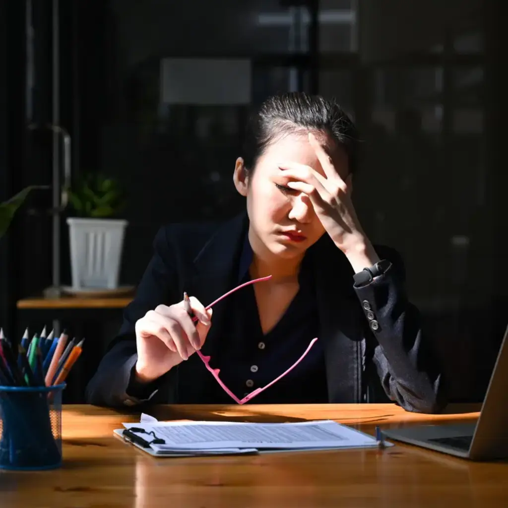 Frustrated founder juggling emails, resumes, and spreadsheets.