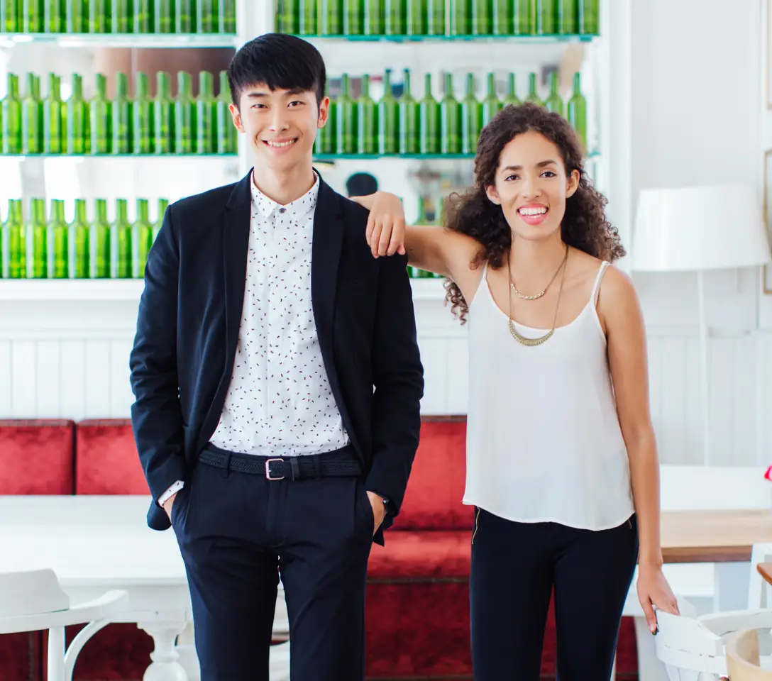 A diverse team of remote professionals collaborating on a digital whiteboard with AI-powered data visualizations